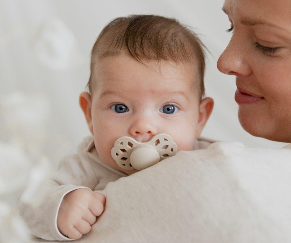 Infinity Pacifer Ivory Blush | Bibs1